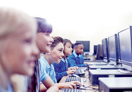 Children learning at monitors  Children learning at monitors